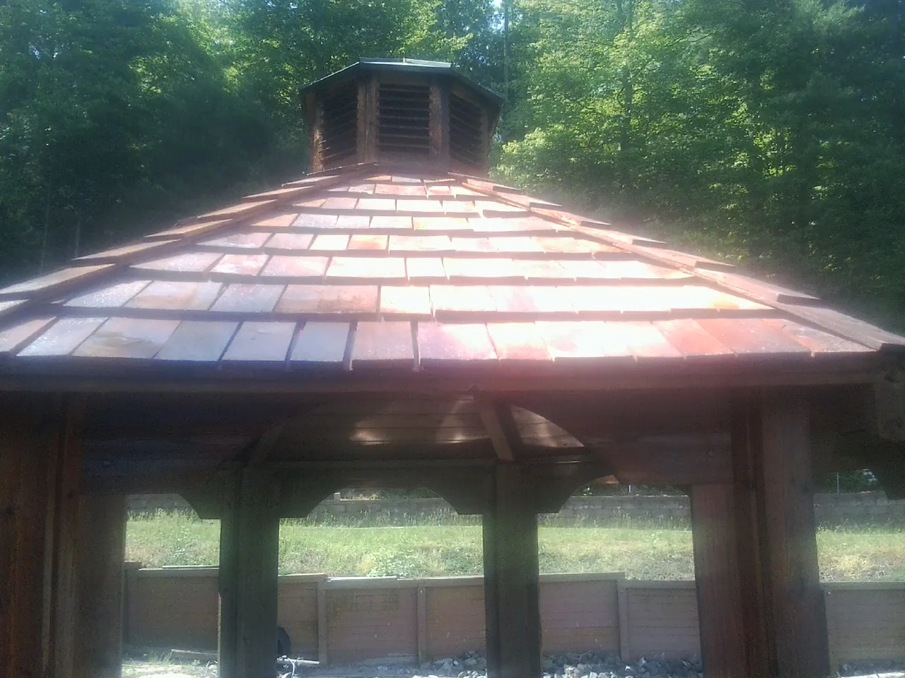 New cedar shake roof and cupola on a lakeside gazebo in Gaylordsville